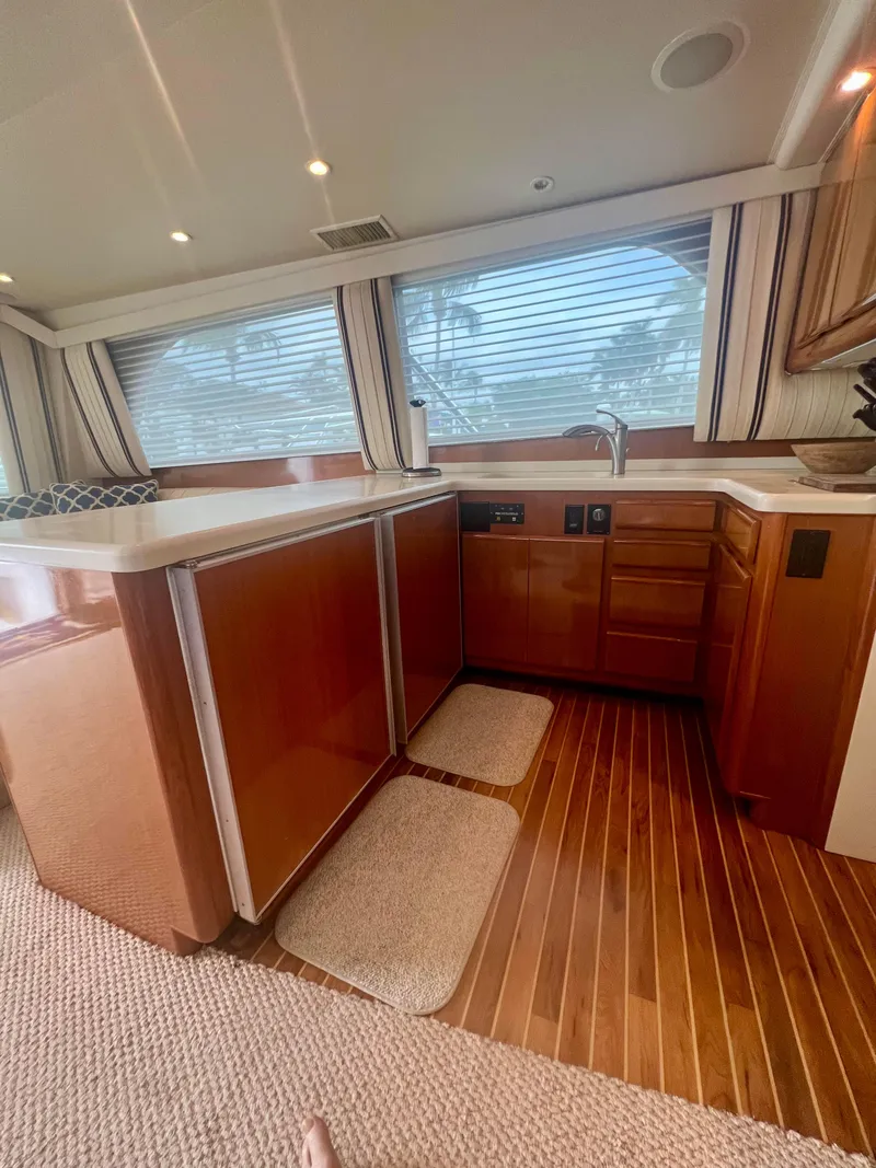 Slide: The Image of Interior of 1999 Viking Conv Sport Fisher yacht with wood cabinetry and flooring. - 15