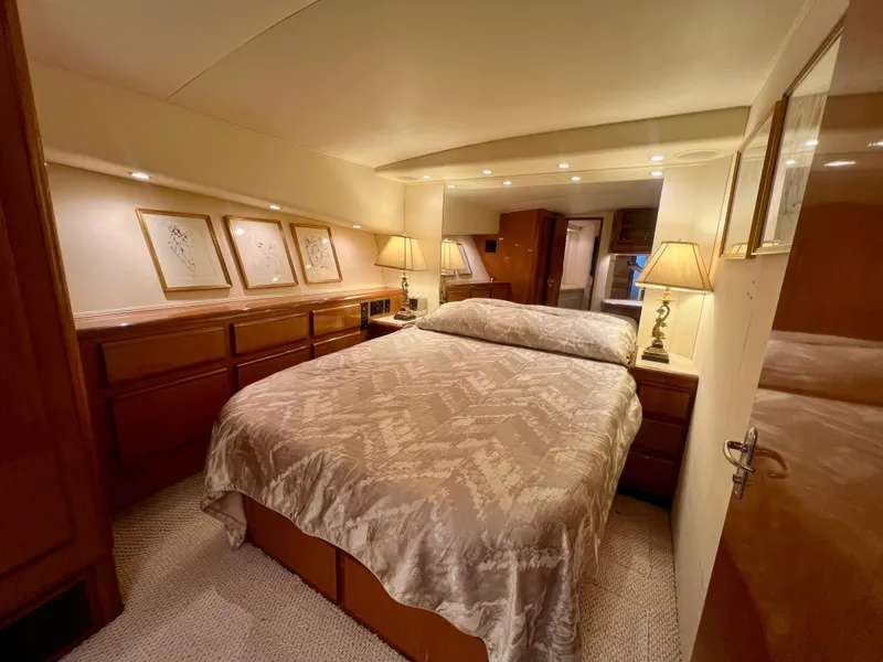 Slide: The Image of Luxurious bedroom interior of 1999 Viking Conv Sport Fisher yacht with elegant decor. - 19