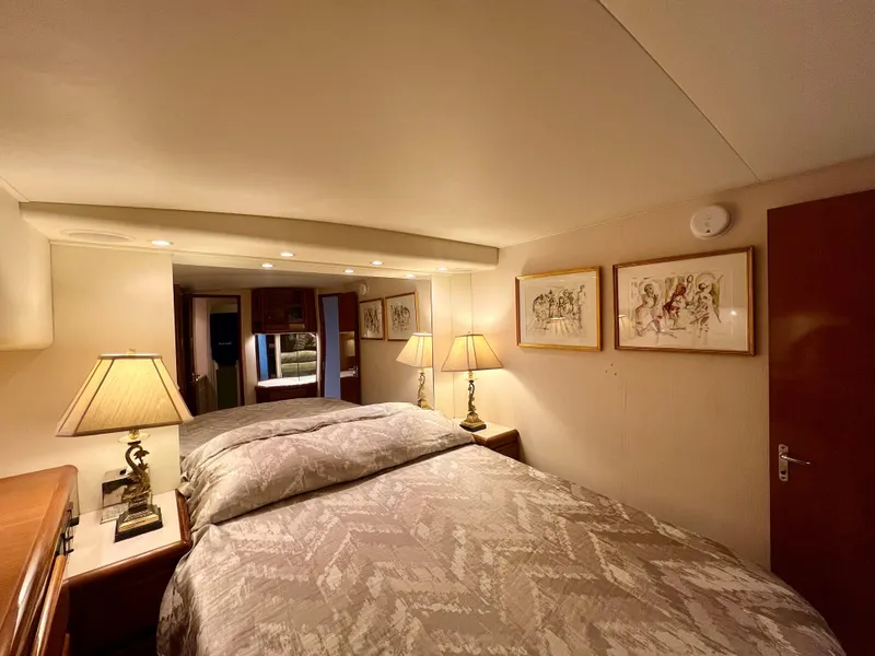 Slide: The Image of Luxurious bedroom interior of 1999 Viking Conv Sport Fisher yacht with elegant decor. - 20