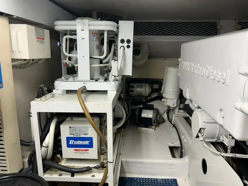 Slide: The Image of Engine room of 1999 Viking Conv Sport Fisher with marine diesel equipment. - 31