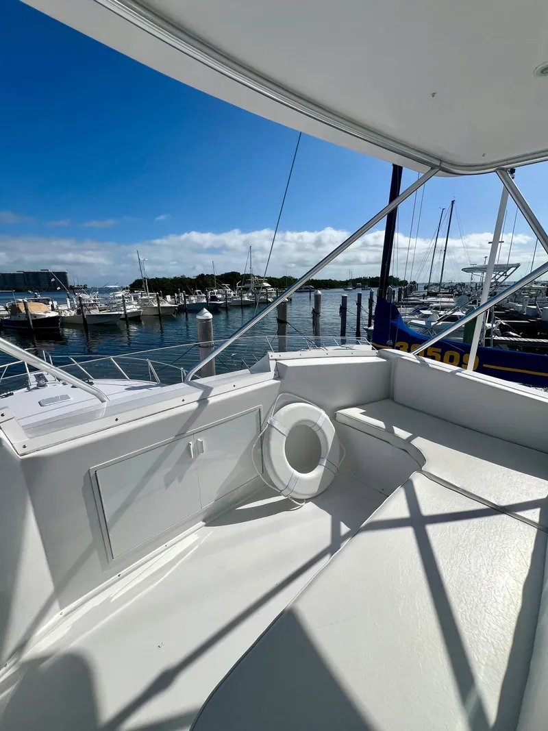 Slide: The Image of 1999 Viking Conv Sport Fisher boat interior with marina view. - 41