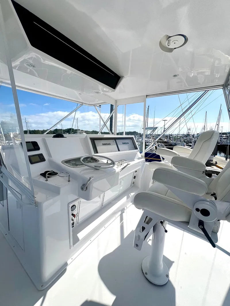 Slide: The Image of 1999 Viking Conv Sport Fisher helm with modern controls and seating. - 42