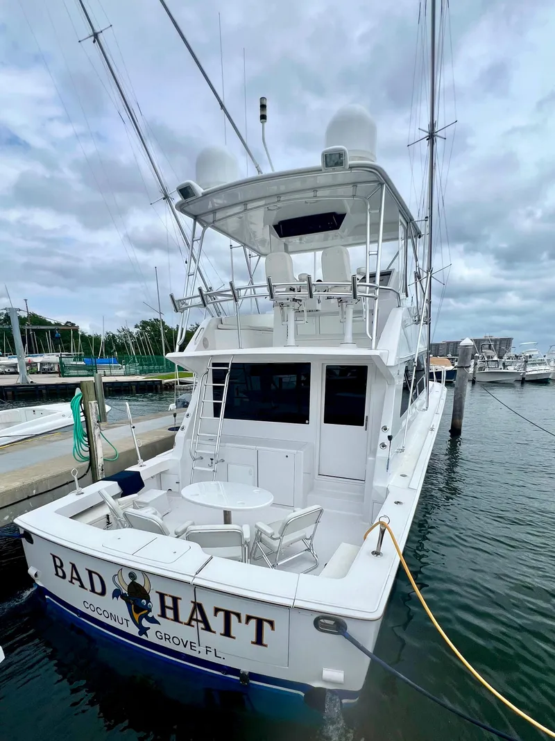 Slide: The Image of 1999 Viking Conv Sport Fisher boat docked, rear view, named "Bad Hatt," Coconut Grove, FL. - 5