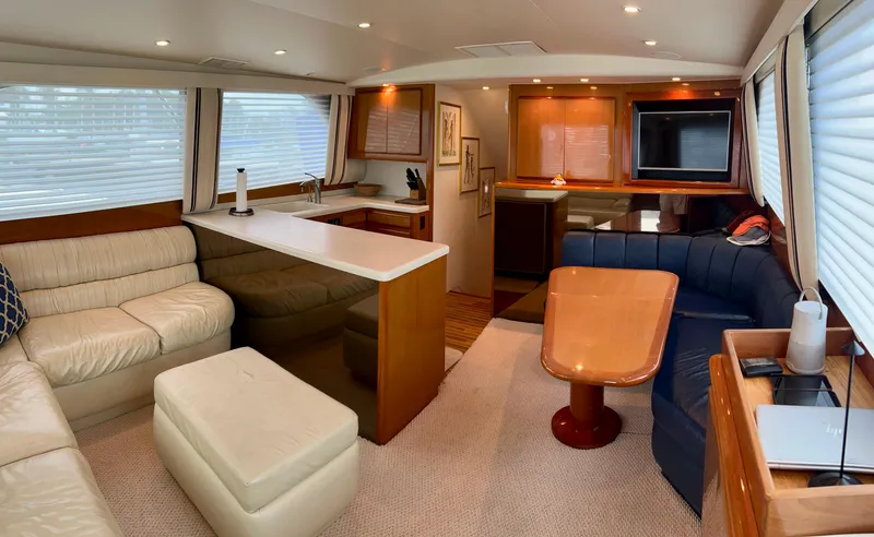 Slide: The Image of Luxurious interior of 1999 Viking Conv Sport Fisher yacht with cozy seating and modern amenities. - 7