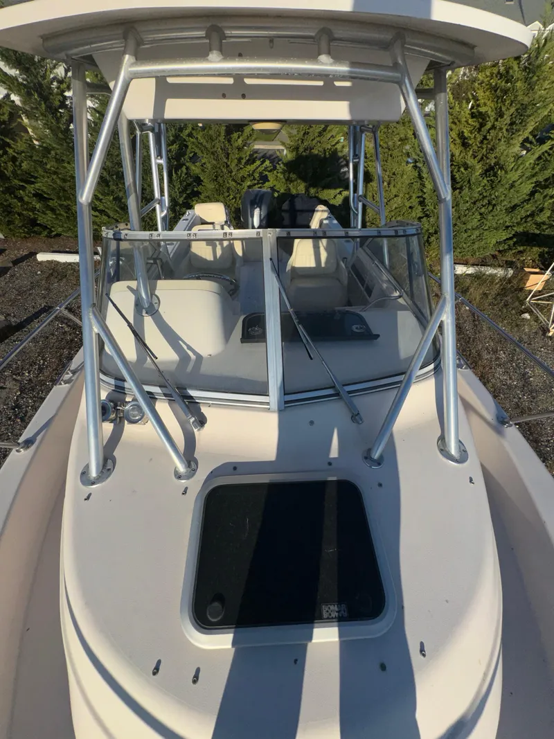 Slide: The Image of 2006 Grady-White Seafarer 226 boat with T-top and windshield, parked outdoors. - 15