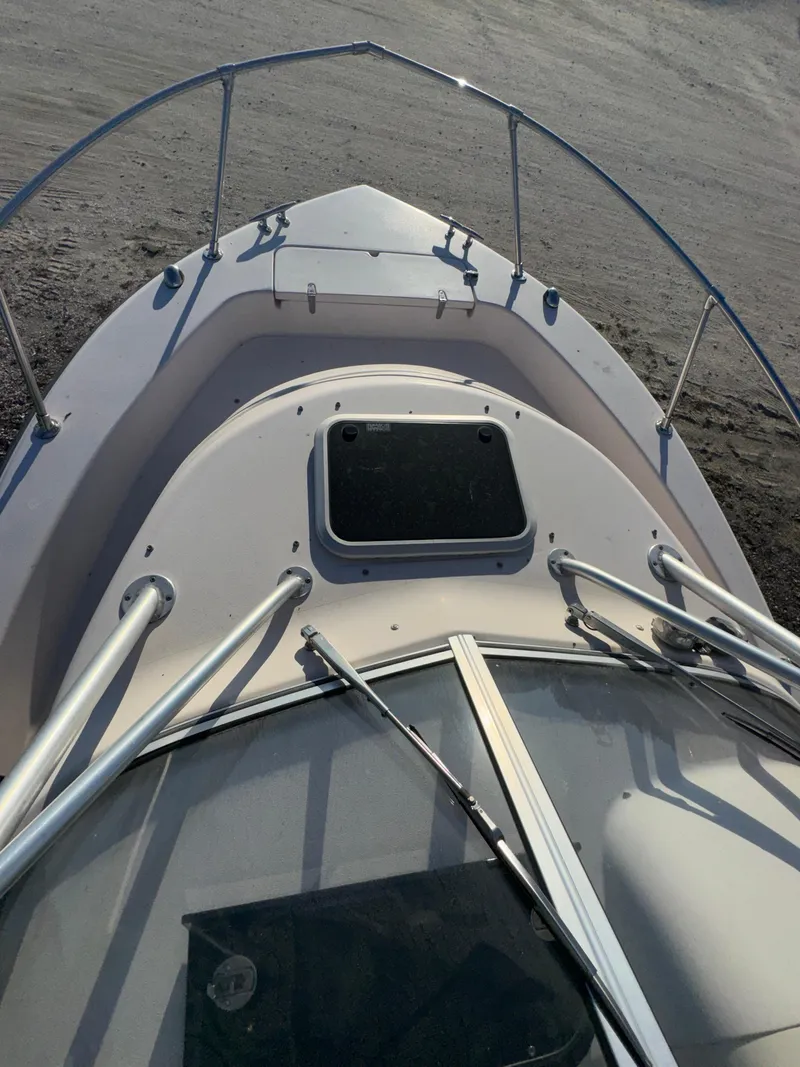 Slide: The Image of 2006 Grady-White Seafarer 226 boat deck with railing and hatch. - 16