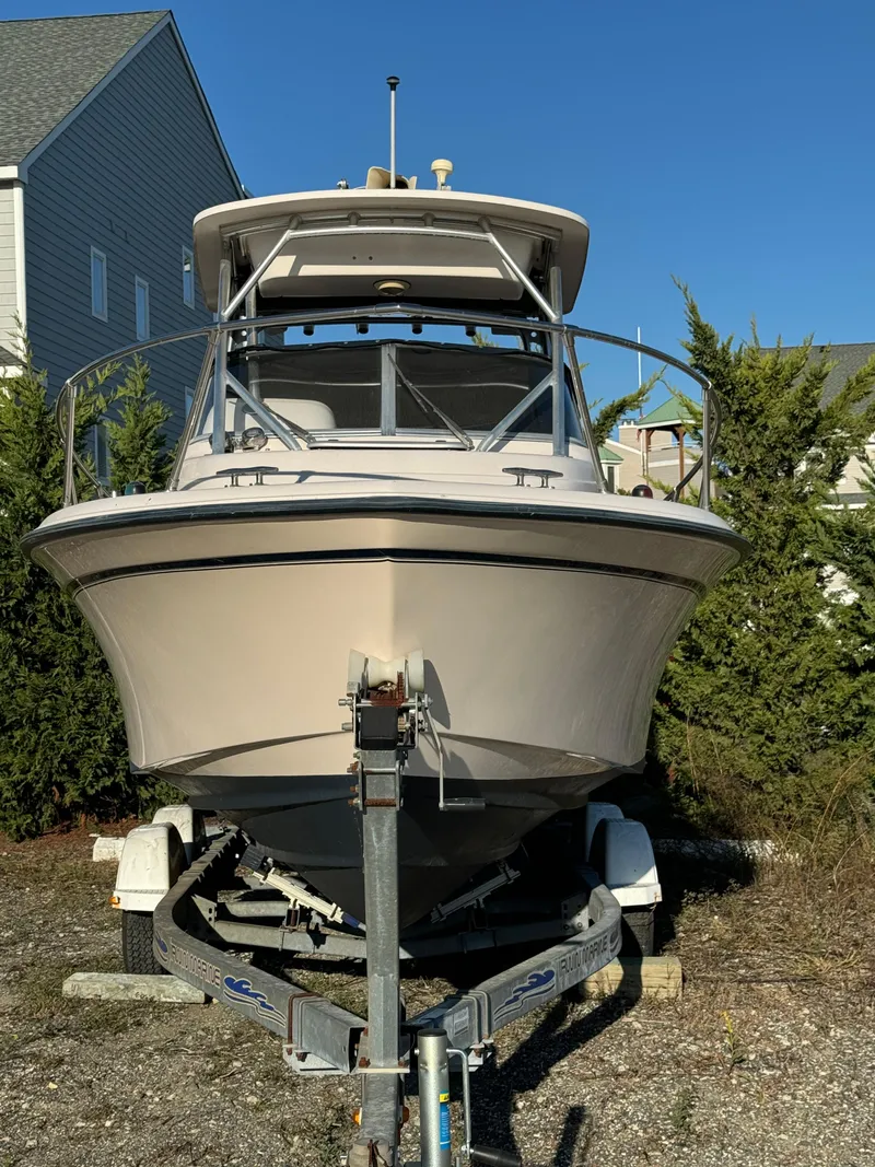 Slide: The Image of 2006 Grady-White Seafarer 226 boat on trailer, parked outdoors. - 2