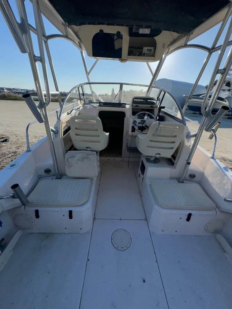 Slide: The Image of 2006 Grady-White Seafarer 226 boat interior with seating and steering wheel. - 5