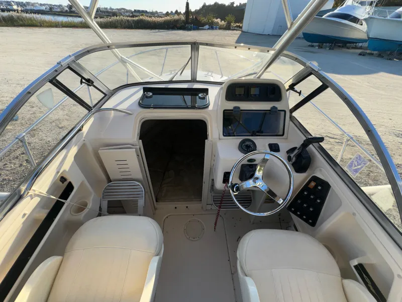 Slide: The Image of 2006 Grady-White Seafarer 226 boat interior with steering wheel and dashboard. - 7