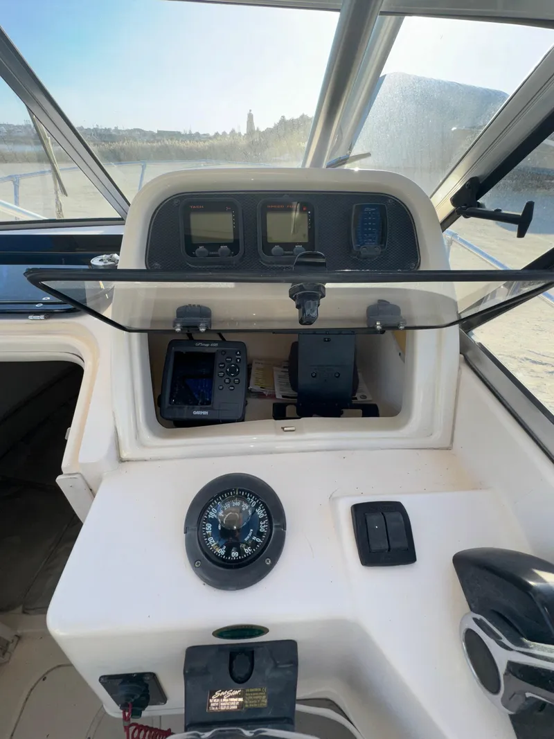 Slide: The Image of Grady-White Seafarer 226 boat dashboard with navigation instruments, 2006 model. - 9