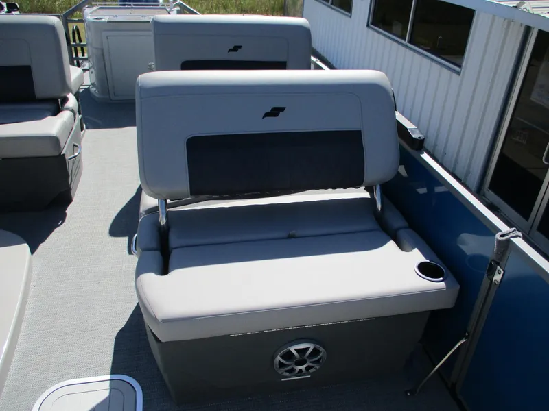 Slide: The Image of 2025 Starcraft CX 23 RL boat interior with gray seating and cup holder. - 10