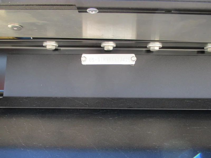 Slide: The Image of Close-up of Starcraft CX 23 RL 2025 model component with bolts and metal plate. - 20