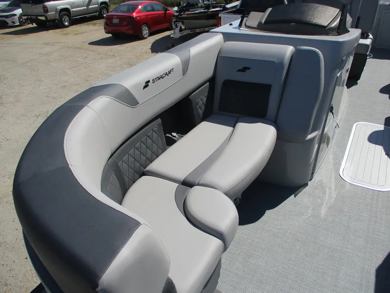 Slide: The Image of 2025 Starcraft CX 23 RL boat interior with gray seating and modern design. - 8