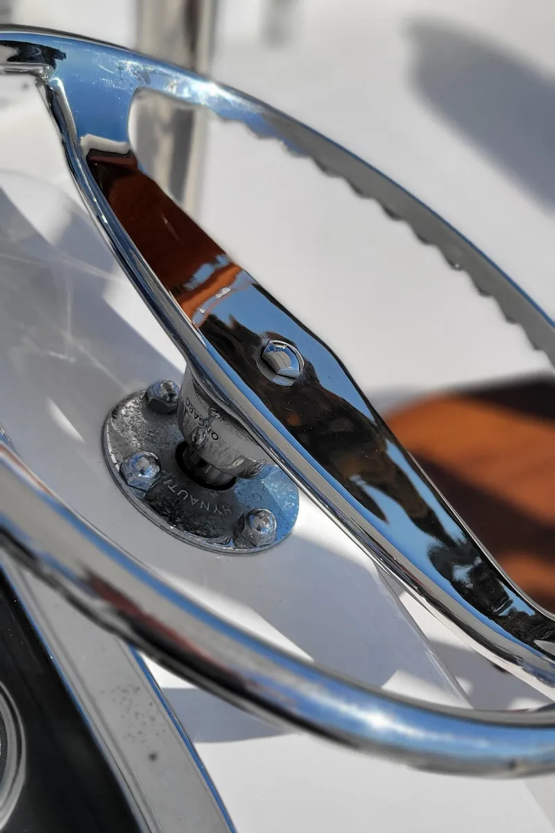 Slide: The Image of Close-up of a 2017 L&H 33 boat steering wheel, chrome finish. - 13