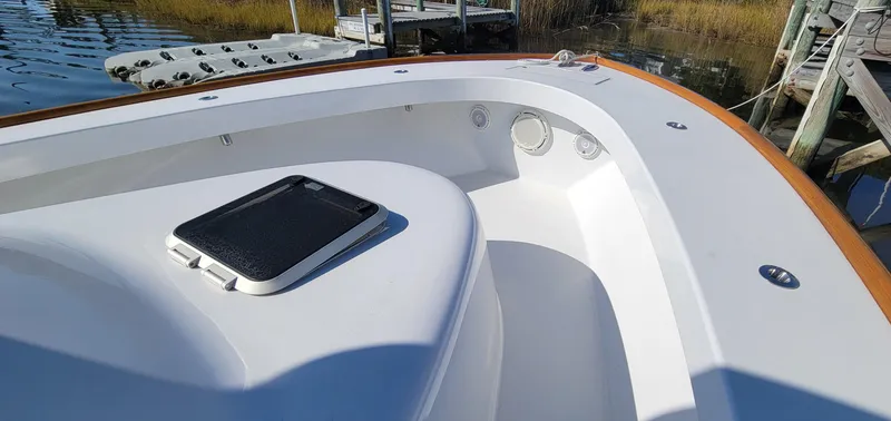 Slide: The Image of 2017 L&H 33 boat deck with hatch, docked by wooden pier. - 17