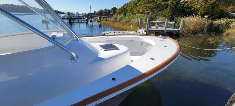 Slide: The Image of 2017 L&H 33 boat docked by a scenic waterfront. - 19