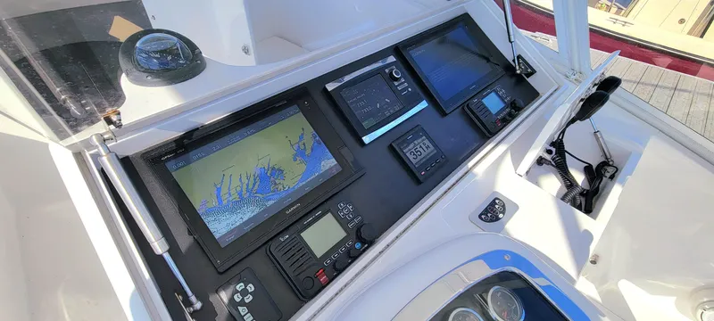 Slide: The Image of Boat dashboard with navigation screens and controls, L&H 33 model, 2017. - 21