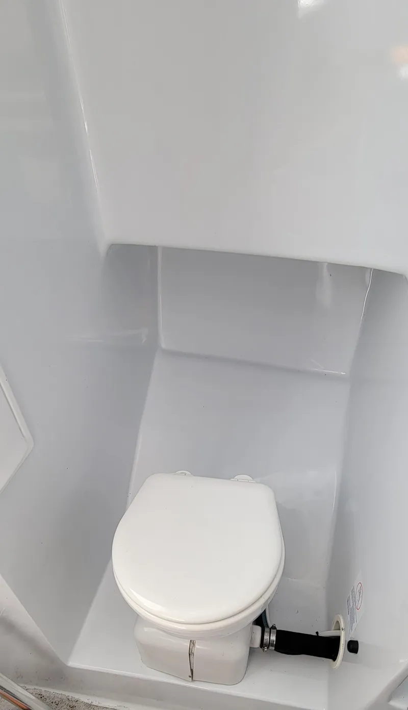 Slide: The Image of Compact white marine toilet in L&H 33 boat, 2017 model. - 26