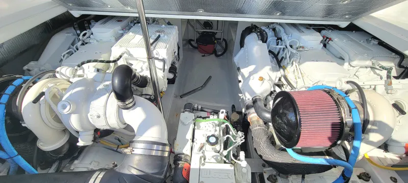 Slide: The Image of Engine compartment of a 2017 L&H 33 boat, showcasing dual engines and components. - 30