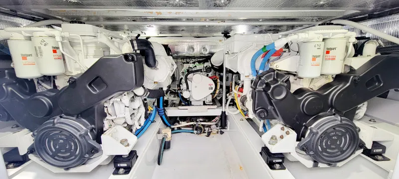 Slide: The Image of Twin engines in a 2017 L&H 33 boat, showcasing detailed mechanical components. - 31