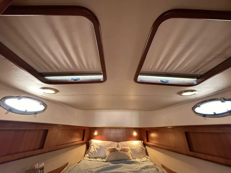 Slide: The Image of Luxurious cabin interior of 2008 Rivolta Coupe 4.5 with wooden accents and cozy bedding. - 13