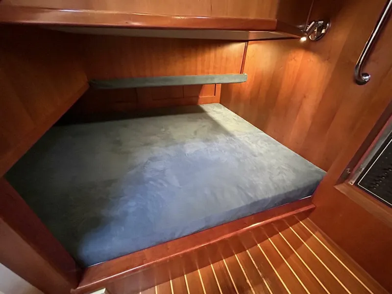 Slide: The Image of Luxurious cabin interior of 2008 Rivolta Coupe 4.5 with cozy bed and wooden accents. - 19