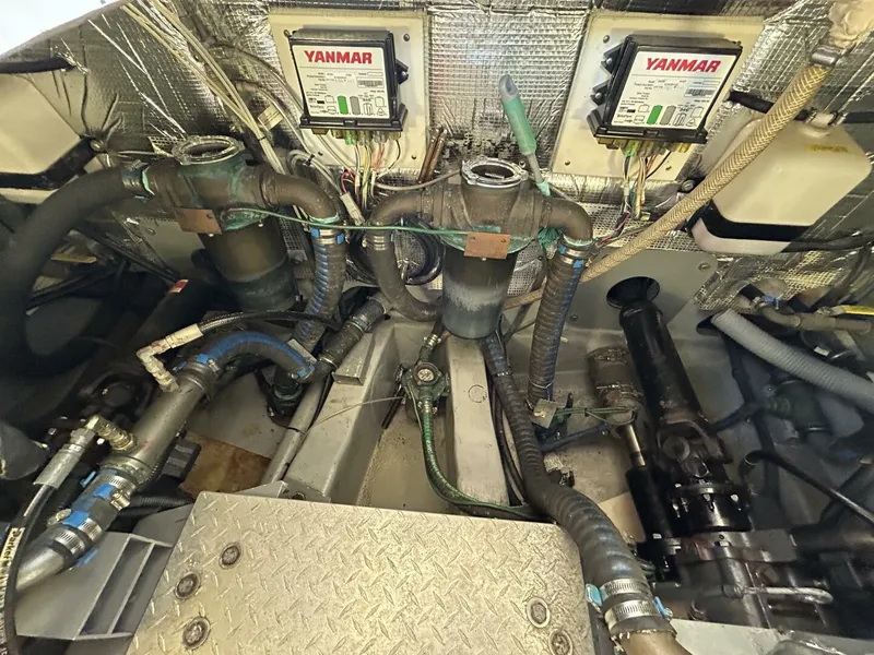 Slide: The Image of 2008 Rivolta Coupe 4.5 interior with TV and control panel, featuring wood paneling. - 27