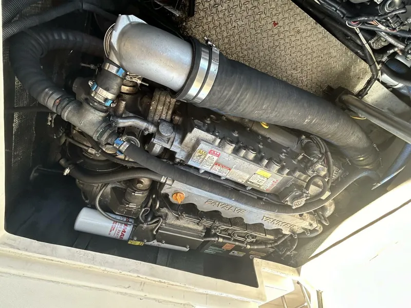 Slide: The Image of 2008 Rivolta Coupe 4.5 yacht docked at sunset, featuring sleek design and elegant lines. - 38