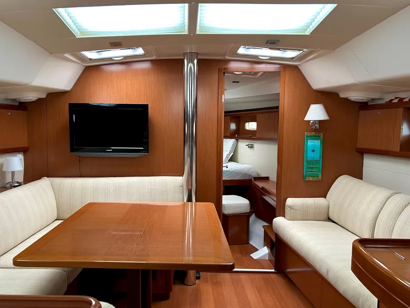Slide: The Image of Interior of 2008 Beneteau Oceanis 46 yacht with cozy seating and modern amenities. - 13