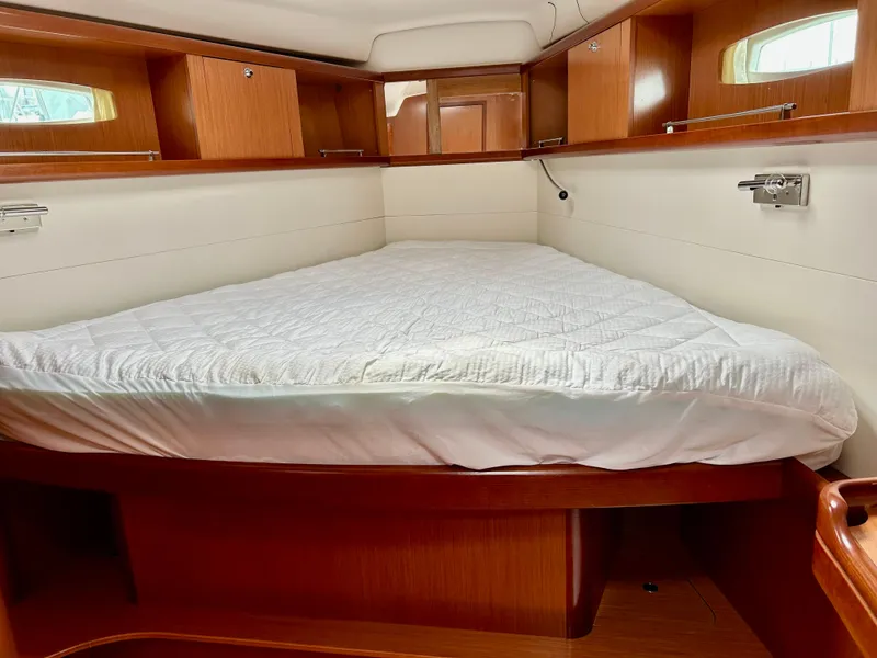 Slide: The Image of Interior cabin of 2008 Beneteau Oceanis 46 sailboat with cozy bed and wooden finish. - 15