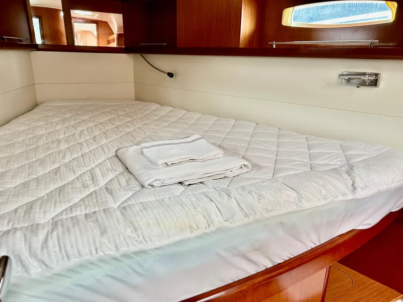 Slide: The Image of Interior cabin of 2008 Beneteau Oceanis 46 yacht with neatly made bed. - 16