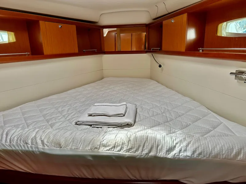 Slide: The Image of Cozy cabin interior of 2008 Beneteau Oceanis 46 with neatly made bed. - 17