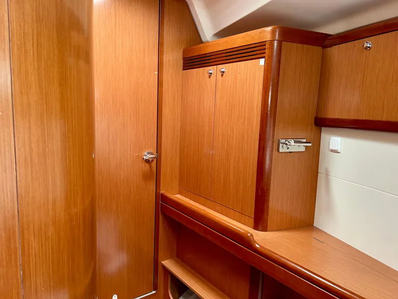 Slide: The Image of Interior of 2008 Beneteau Oceanis 46, featuring wooden cabinetry and sleek design. - 18