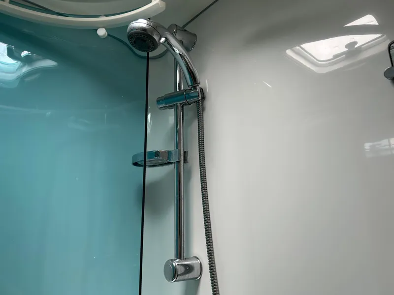 Slide: The Image of Shower area in 2008 Beneteau Oceanis 46 yacht, featuring modern chrome fixtures. - 22