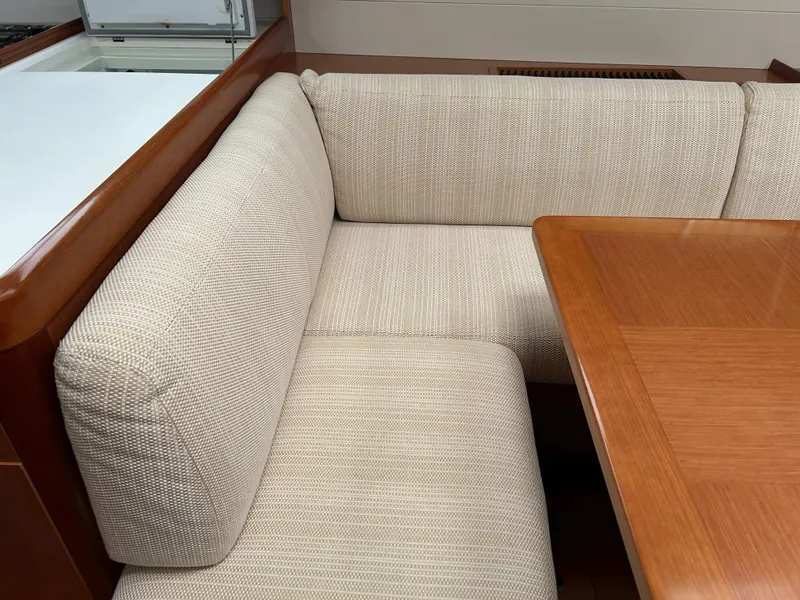 Slide: The Image of Beige cushioned seating area in 2008 Beneteau Oceanis 46 yacht interior. - 26