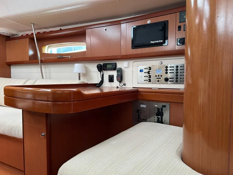 Slide: The Image of Interior of 2008 Beneteau Oceanis 46 yacht with navigation equipment and wooden cabinetry. - 28