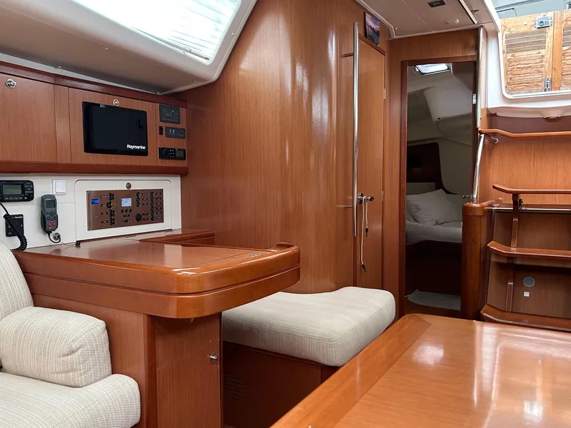 Slide: The Image of Interior of 2008 Beneteau Oceanis 46 yacht with wood finish and seating area. - 29