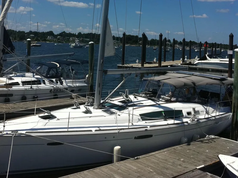 Slide: The Image of 2008 Beneteau Oceanis 46 sailboat docked at a marina on a sunny day. - 3