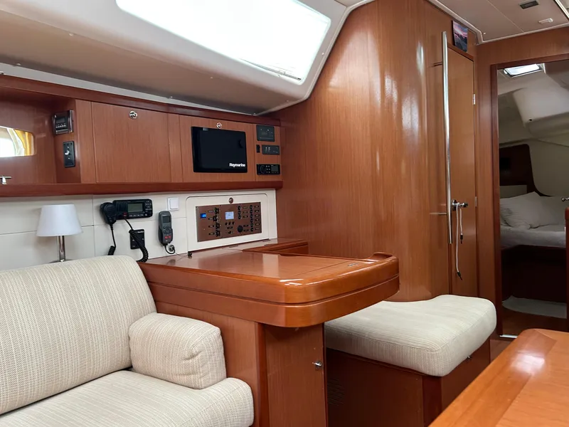 Slide: The Image of Interior of 2008 Beneteau Oceanis 46 yacht with wood finish and comfortable seating. - 30