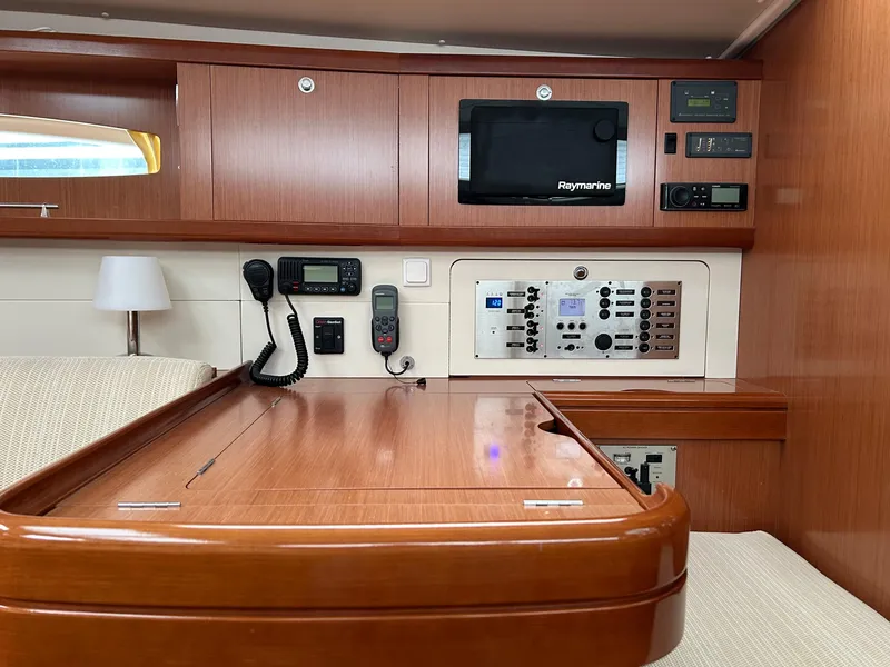 Slide: The Image of Interior of 2008 Beneteau Oceanis 46 yacht with navigation equipment and wooden cabinetry. - 31