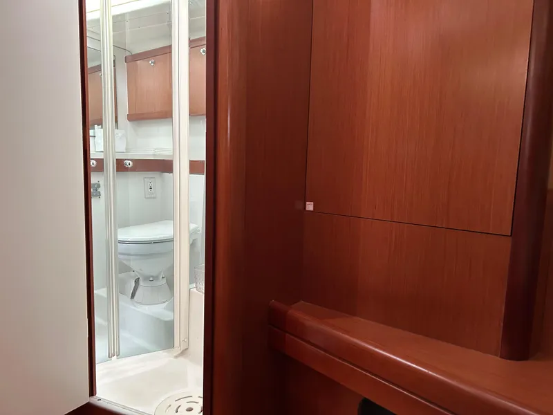 Slide: The Image of Interior of 2008 Beneteau Oceanis 46 yacht showing bathroom with wooden cabinetry. - 38