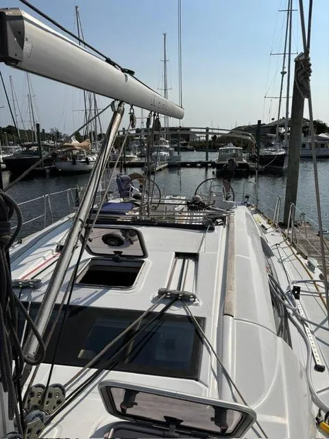 Slide: The Image of 2008 Beneteau Oceanis 46 sailboat docked in a marina, showcasing deck and rigging. - 4