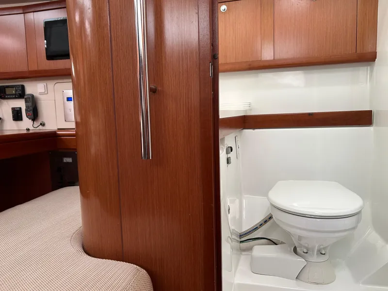 Slide: The Image of Interior of 2008 Beneteau Oceanis 46 yacht showing bathroom and wooden cabinetry. - 42