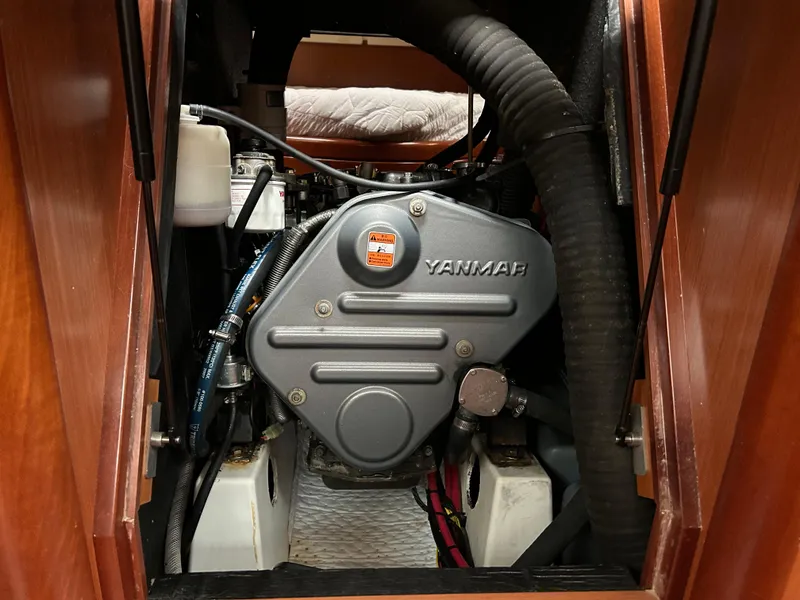 Slide: The Image of Engine compartment of a 2008 Beneteau Oceanis 46 sailboat, featuring a Yanmar engine. - 48