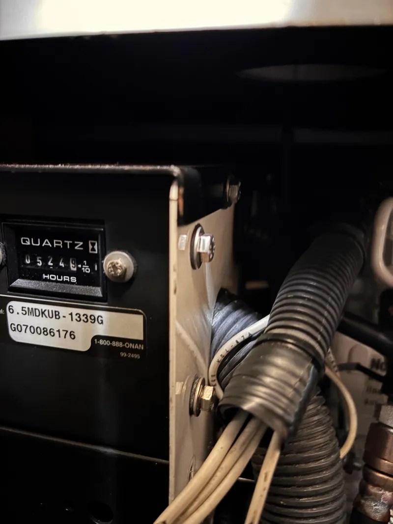 Slide: The Image of Engine compartment of 2008 Beneteau Oceanis 46 sailboat, showing hour meter and wiring. - 50