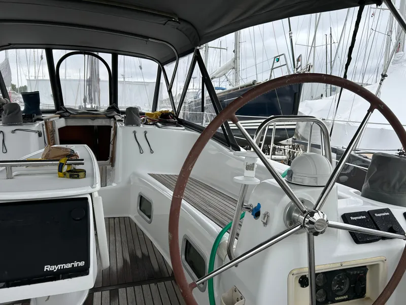 Slide: The Image of Beneteau Oceanis 46 sailboat cockpit, 2008 model, featuring steering wheel and navigation equipment. - 6