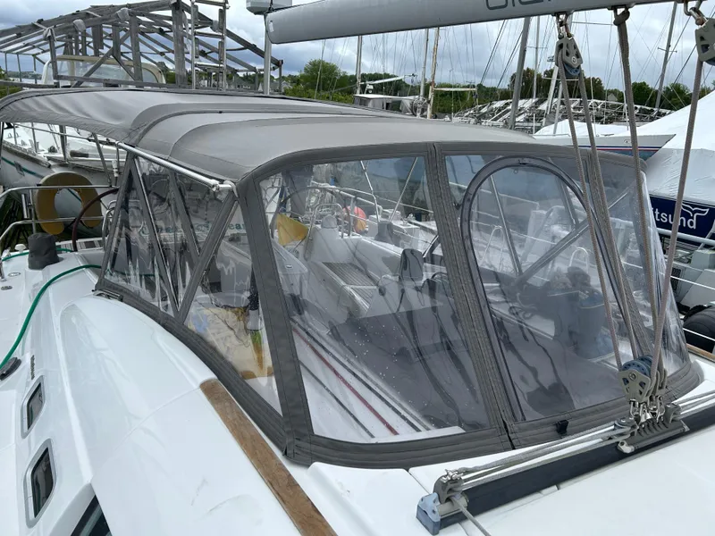 Slide: The Image of 2008 Beneteau Oceanis 46 sailboat with cockpit enclosure, docked at marina. - 8