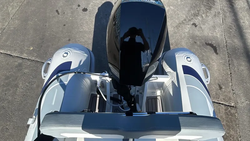 Slide: The Image of 2025 Highfield CL340 inflatable boat with outboard motor, viewed from above on concrete surface. - 4