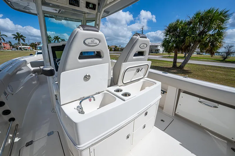 Slide: The Image of 2022 Sailfish 272CC boat interior with dual seats and storage compartments. - 25