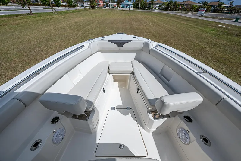 Slide: The Image of 2022 Sailfish 272CC boat interior with white seating and spacious layout. - 28